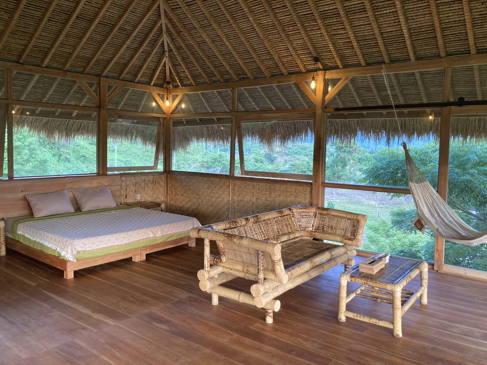 Big Bungalow upper floor with king bed and bamboo seating
