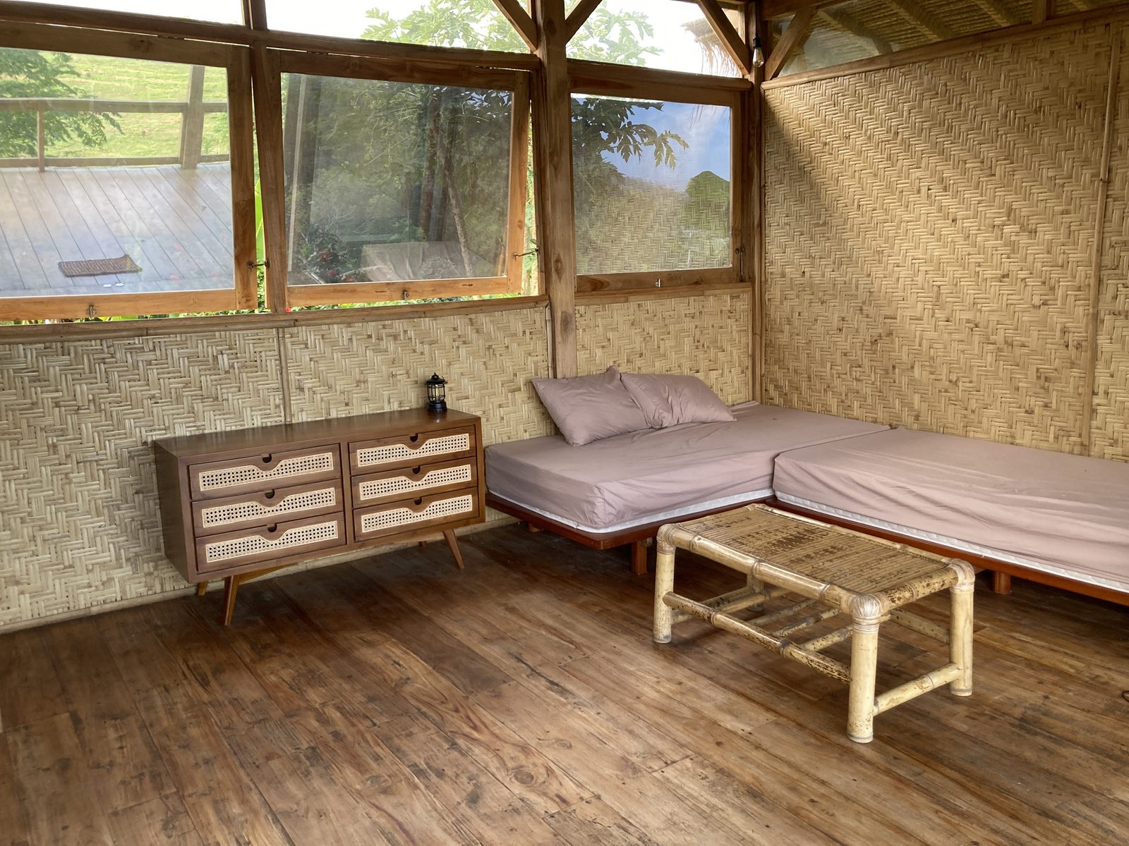 Ground floor living area at Big Bungalow with twin daybeds and Sumbawa teak dresser