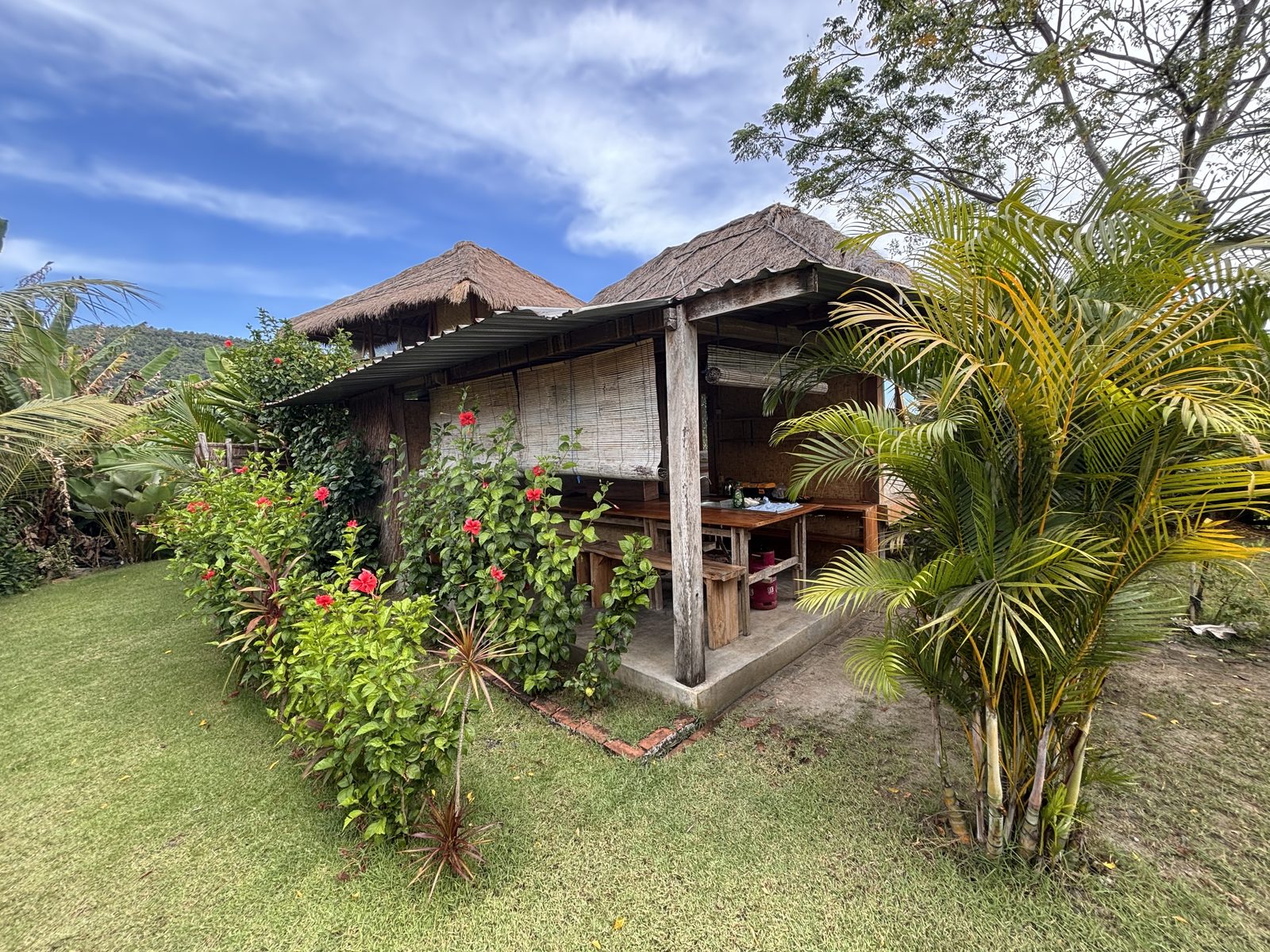 Small Bungalow exterior with tropical garden at CintaDamai