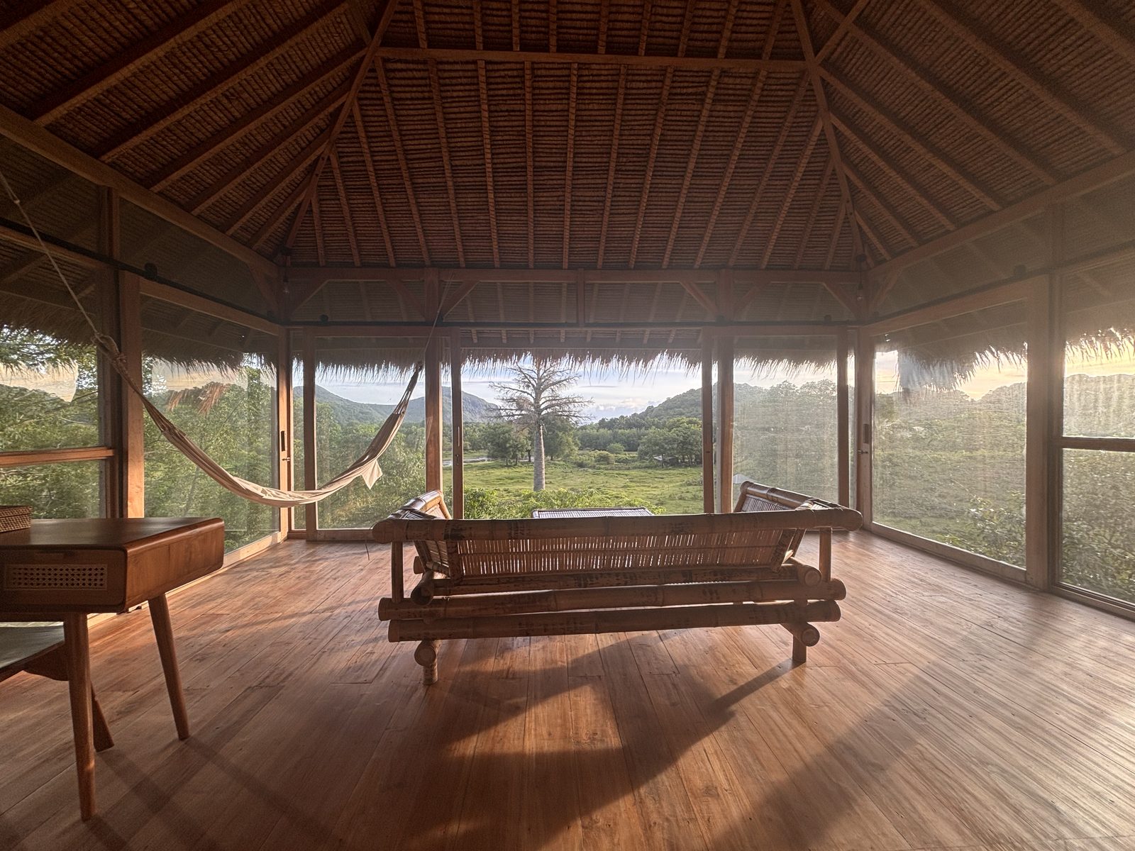 Big Bungalow upper floor lounge with ranch view at golden hour